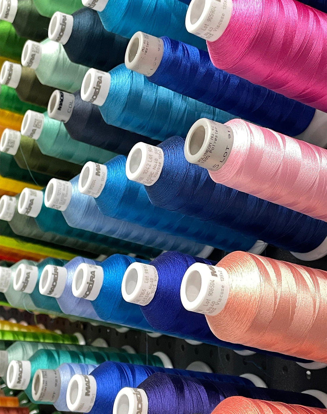 Close-up of embroidery thread colour options used for custom logo stitching