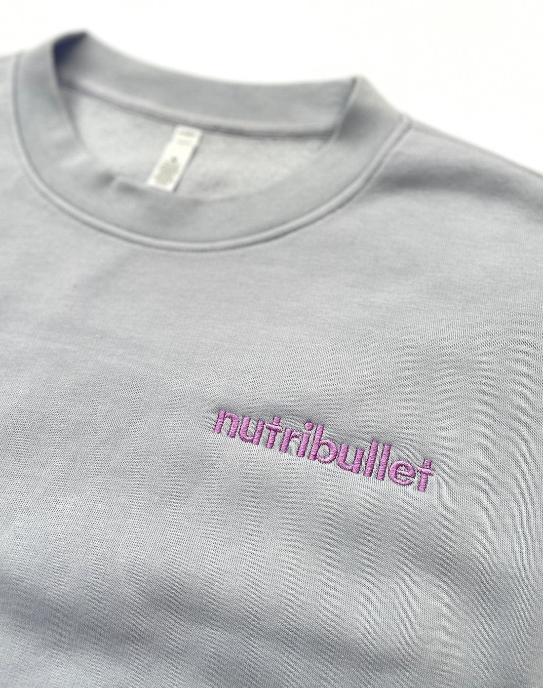 Finished embroidered logo on clothing with clean stitching and professional detail